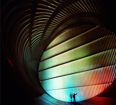 Building surrounded by cars and trucks